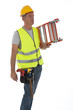 Construction worker wearing hard hat and vest