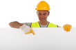 Construction worker wearing hard hat and vest