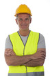 Construction worker wearing hard hat and vest