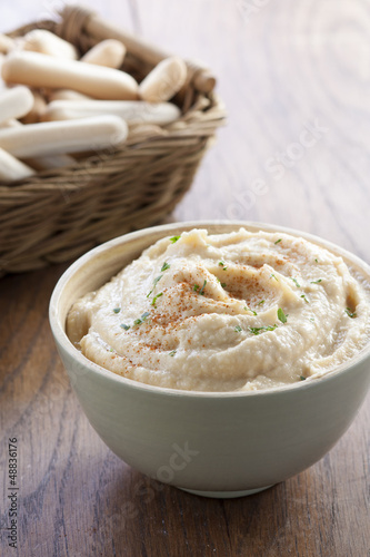 Photo: Chickpea hummus bowl with bread sticks Chickpea hummus bowl with bread sticks