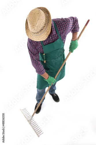 Photo: Gardener holding gardening tool Gardener holding gardening tool