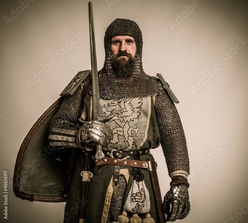 Photo: Medieval knight with sword and shield Medieval knight with sword and shield