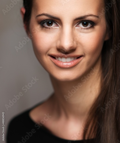 Photo: Young brunette woman with beautiful smile Young brunette woman with beautiful smile