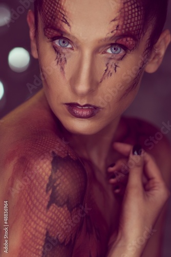 Photo: Woman with snake body-art Woman with snake body-art