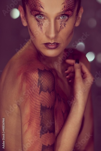 Photo: Woman with snake body-art Woman with snake body-art