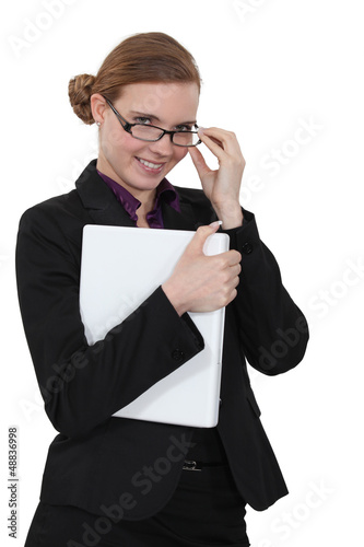Photo: Young businesswoman with playful smile Young businesswoman with playful smile
