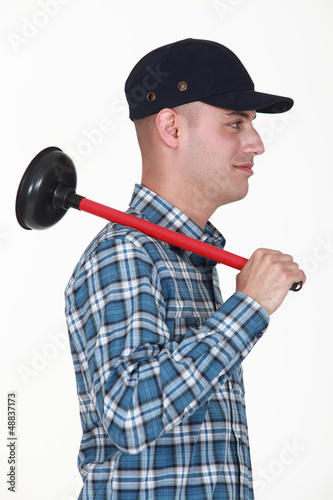 Photo: Plumber with a plunger Plumber with a plunger