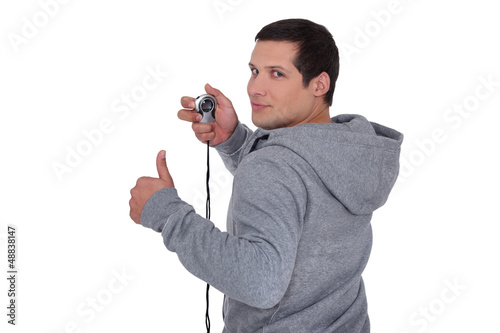 Photo: Man holding a stopwatch Man holding a stopwatch