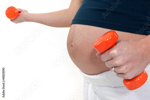 Photo: Pregnant woman working out Pregnant woman working out