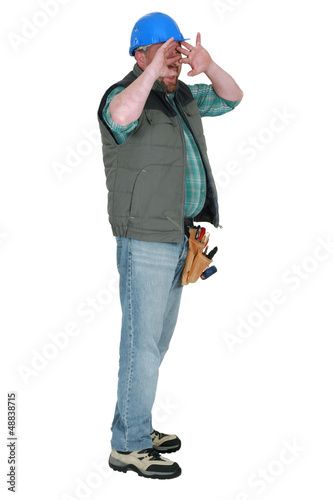 Photo: Tradesman shielding his face Tradesman shielding his face