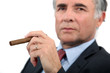 Senior businessman with cigar