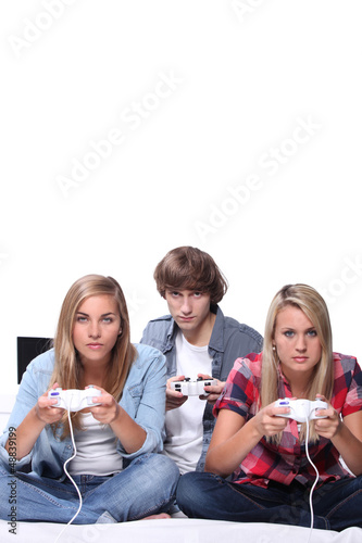 Photo: Teenagers playing computer games Teenagers playing computer games