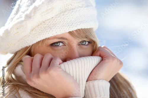 Photo: blonde wrapped in pullover by cold weather blonde wrapped in pullover by cold weather