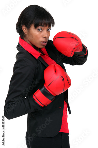 Photo: Businesswoman in boxing gloves Businesswoman in boxing gloves