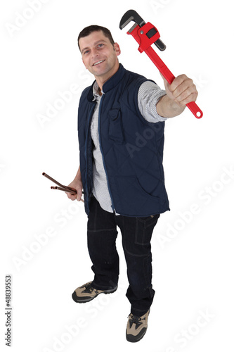 Photo: Plumber holding his favorite wrench Plumber holding his favorite wrench
