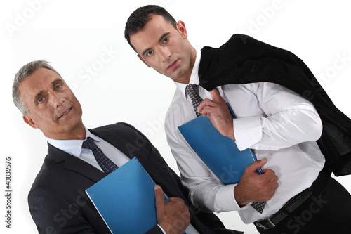 Photo: Businessmen holding folders Businessmen holding folders