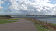 Rotterdam waterway with wind turbine in distance
