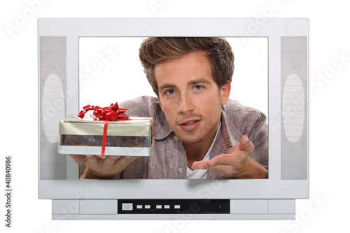 Photo: Man passing through TV screen Man passing through TV screen