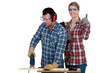 Woman inspecting carpenter