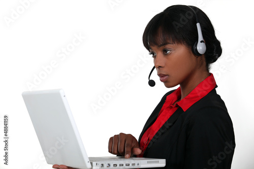Photo: An African American businesswoman at work. An African American businesswoman at work.