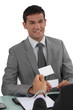 Two businessmen exchanging cards
