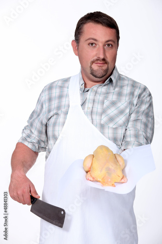 Photo: Butcher holding chicken Butcher holding chicken