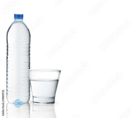 Photo: Bottle of water with a glass Bottle of water with a glass