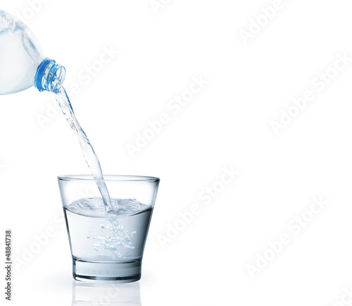 Photo: Bottle of water with a glass Bottle of water with a glass