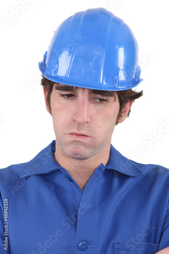 Photo: Troubled construction worker Troubled construction worker