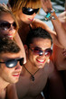 Photo: Group of young people on a beach holiday Group of young people on a beach holiday