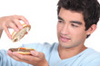 Man opening a hamburger