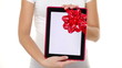 Woman giving Tablet PC gift