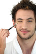 Man applying make-up