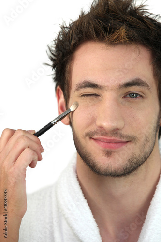 Photo: Man applying make-up Man applying make-up