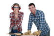 Tradesman training his apprentice