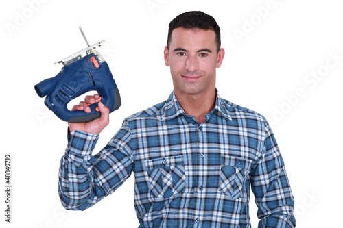 Photo: carpenter holding sander machine carpenter holding sander machine