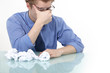 tired businessman rubbing his eyes