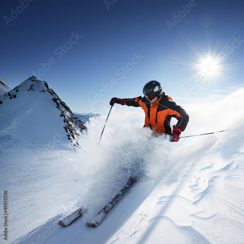 Photo: Skier in high mountains Skier in high mountains