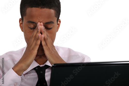 Photo: young black businessman looking tired young black businessman looking tired