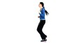 Brunette jogging in tracksuit