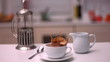 Sugar cube falling in coffee