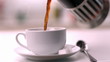 Coffee being poured into cup