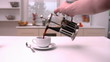 Man pouring coffee into cup