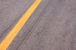 Rubber tyre tracks on a tar road
