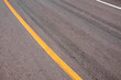 Rubber tyre tracks on a tar road