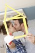 Photo: Kissing couple renewing home Kissing couple renewing home