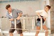 Young couple having fun during renovation