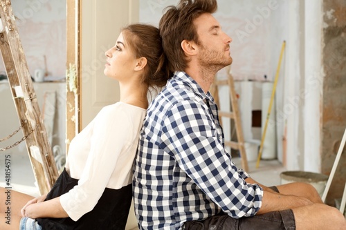 Photo: Young couple exhausted in DIY Young couple exhausted in DIY