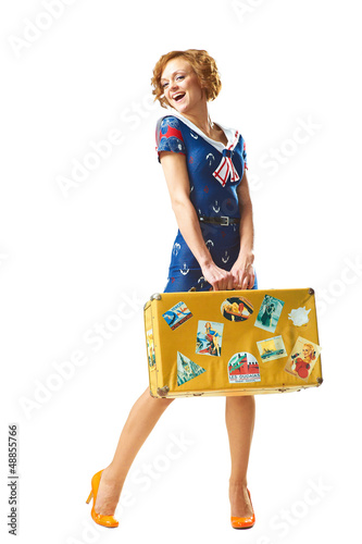 Photo: Beauty young girl with suitcase in hand Beauty young girl with suitcase in hand