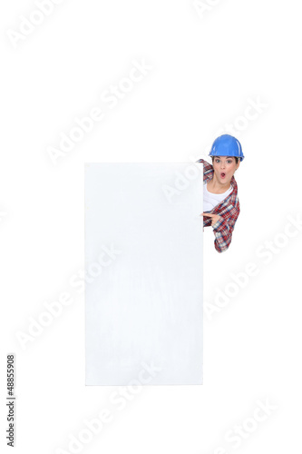 Photo: Construction worker with a blank board Construction worker with a blank board